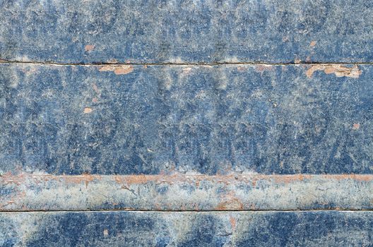 Background from old boards over the years, layers of paint, tinted in blue.