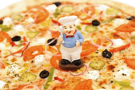 Delicious pizza with two kinds of cheese, olives, pickles and peppers.