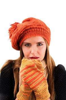 Concept of Beautiful Frozen Girl in Orange Striped Knitted Hat and Mittens, Black Warm Sweater and Scarf isolated on White background