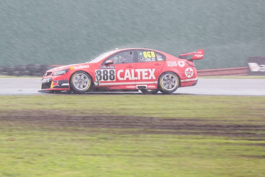 MELBOURNE/AUSTRALIA - SEPTEMBER 17, 2016: TeamVortex driver, Craig Lowndes battling rain in Race 20 of the Wilson Secuirity Sandown 500 'Retro' Endurance race at Sandown raceway.