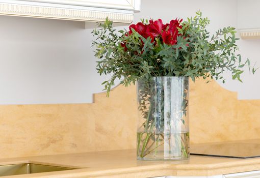 the beautiful flower arrangement in clear glass vase