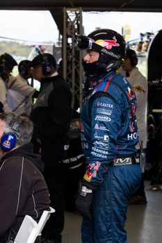 MELBOURNE/AUSTRALIA - SEPTEMBER 17, 2016: Team engineers hard at work at the Wilson Security Sandown 500 'Retro' Endurance race at Sandown raceway.