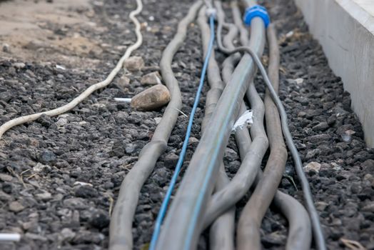 the trail of power electrical cables on the ground