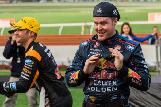 MELBOURNE/AUSTRALIA - SEPTEMBER 17, 2016: Red Bull driver Alexandre Premat being sprayed with champagne after his podium finish at the Wilson Security Sandown 500 'Retro' Endurance race at Sandown raceway.