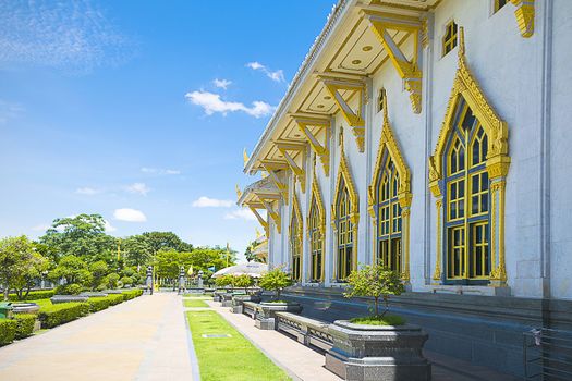 Detail of wall and window temple' construction with clear sky background at Wat Sothorn, Chachoengsao Thailand.