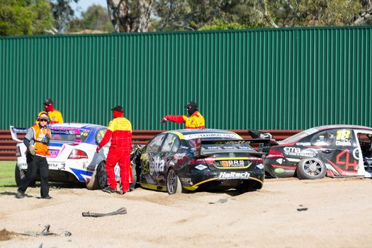 MELBOURNE/AUSTRALIA - SEPTEMBER 17, 2016: Moments after a 5 car smash in the Dunlop Series Race  3 on turn one at the Wilson Security Sandown 500 'Retro' Endurance race at Sandown raceway.