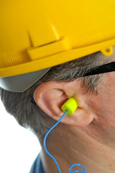 yellow earplug into the ear