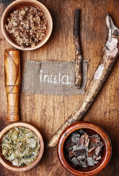 Medicinal plants,herbs in the bowl and elecampane root
