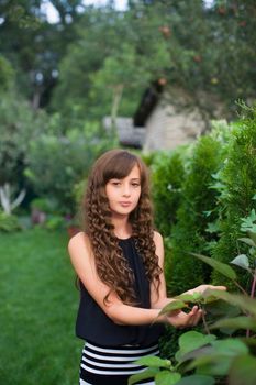 Girl with long hair on nature in a warm summer day