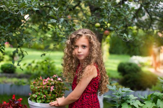 Girl with long hair on nature in a warm summer day