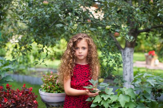 Girl with long hair on nature in a warm summer day