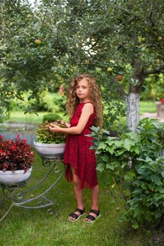 Girl with long hair on nature in a warm summer day