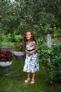 Girl with long hair on nature in a warm summer day