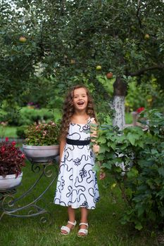 Girl with long hair on nature in a warm summer day