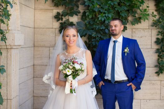 Newlyweds on a walk in a summer day wedding