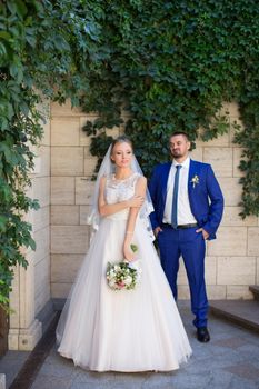 Newlyweds on a walk in a summer day wedding