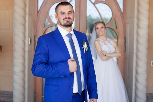 Newlyweds on a walk in a summer day wedding