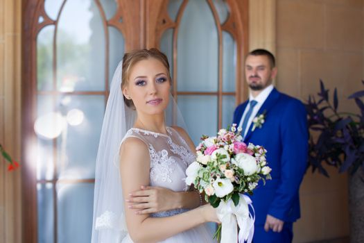 Newlyweds on a walk in a summer day wedding