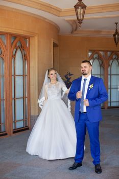 Newlyweds on a walk in a summer day wedding