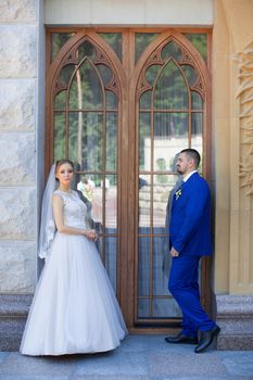 Newlyweds on a walk in a summer day wedding