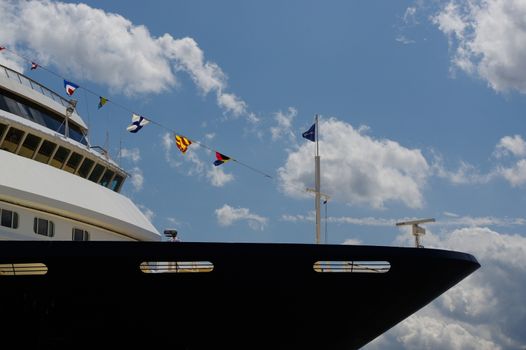 view to the front part of cruise liner moored in the seaport. Closeup. right side