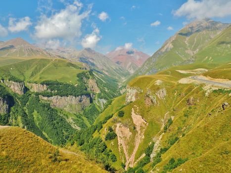 Caucasus Mountains and The Georgian Military Road. Photo was taken on the way from Tbilisi to Kazbegi. It is an outside view from Russian and Georgian Friendship Monument.