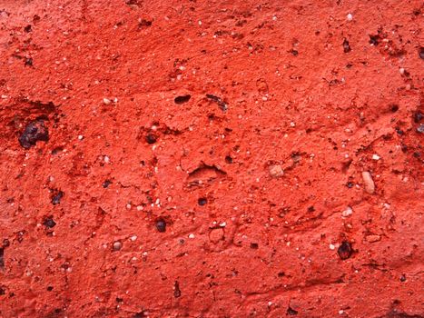 Surface of a red brick in a large scale.