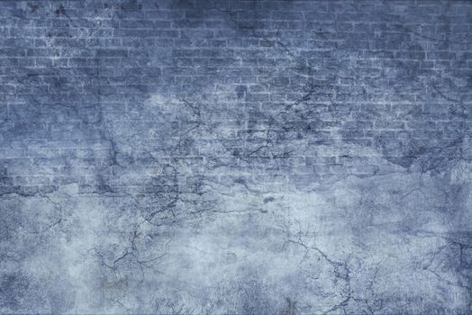 Blue stucco and brick vintage old grunge texture with cracks and scratches