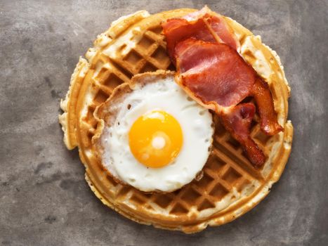 close up of               rustic savory bacon and egg waffle