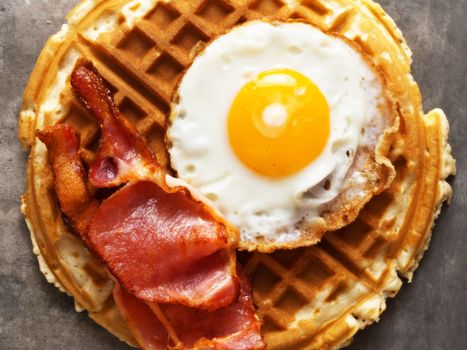 close up of               rustic savory bacon and egg waffle