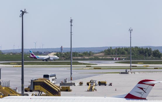 VIENNA, AUSTRIA – APRIL 30th 2016: Plane leaving for taking off on a busy Saturday at Vienna International Airport.