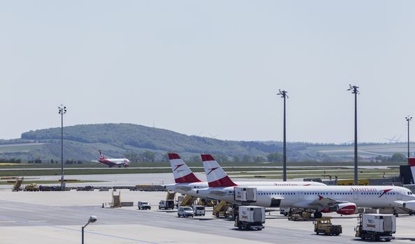 VIENNA, AUSTRIA – APRIL 30th 2016: Austrian Airline planes lined up a busy Saturday at Vienna International Airport.