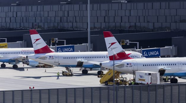 VIENNA, AUSTRIA – APRIL 30th 2016: Austrian Airline planes lined up a busy Saturday at Vienna International Airport.