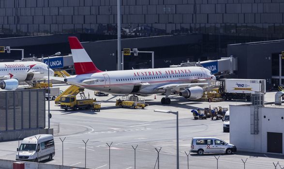 VIENNA, AUSTRIA – APRIL 30th 2016: Austrian Airline planes lined up a busy Saturday at Vienna International Airport.