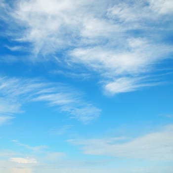 fluffy clouds in the blue sky