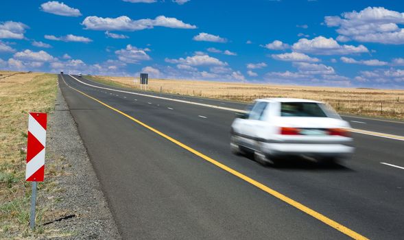 Motor Vehicle or Car travelling along the highway at speed
