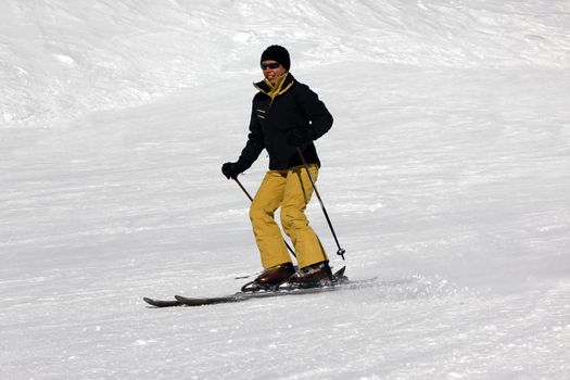 Skier riding fresh powder snow. Europe. Russia. Caucasus.
