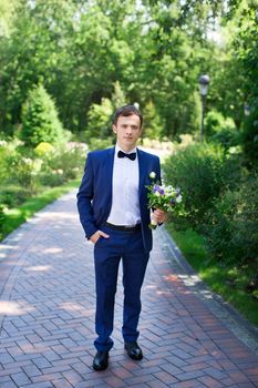 Stylish bride blue suit on a summer day