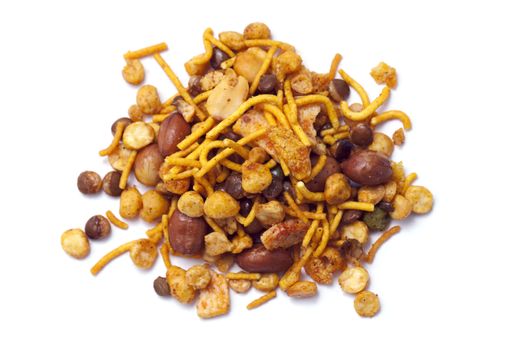 Pile of dry roasted Indian snack mix, isolated over white