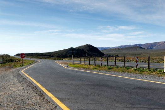 Blue green landscape with a road that leads to the Karoo