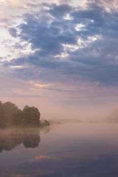 Misty morning on the lake. Spring in Belarus