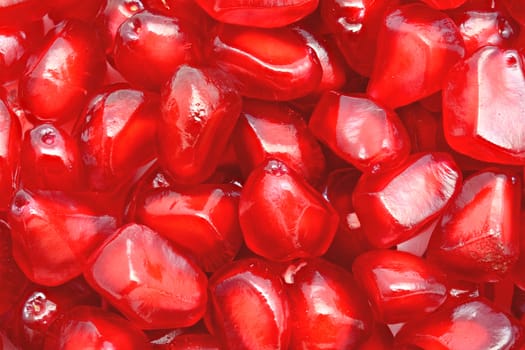 Close-up of ripe indian pomegranate seeds for food background