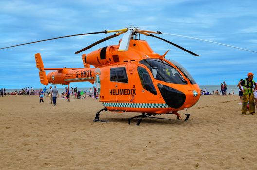 Skegness-England 09 August  2015,  Air Ambulance helicopter during medical emergencies rescue on the beach in Skegness. Editorial photo.