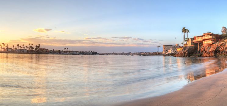 Sunset over the harbor in Corona del Mar, California at the beach in the United States