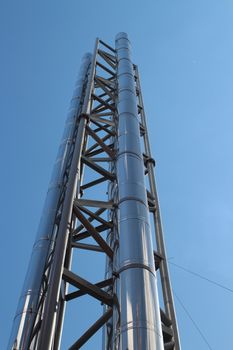 chimney with stainless steel against a background of blue sky