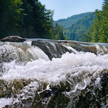 waterfall on the river in the mountains