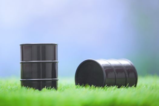 Two oil barrels in the grassland. Horizontal photo