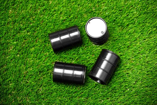 High angle view on four oil drums on a grass