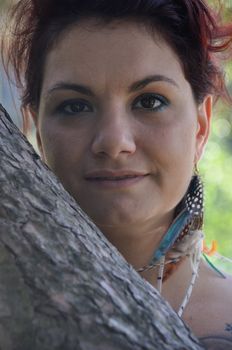 portrait of red  hair woman in a park