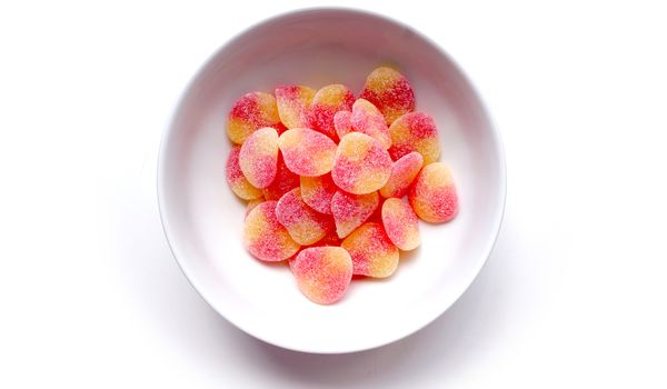 jelly sugar in the white bowl on white background